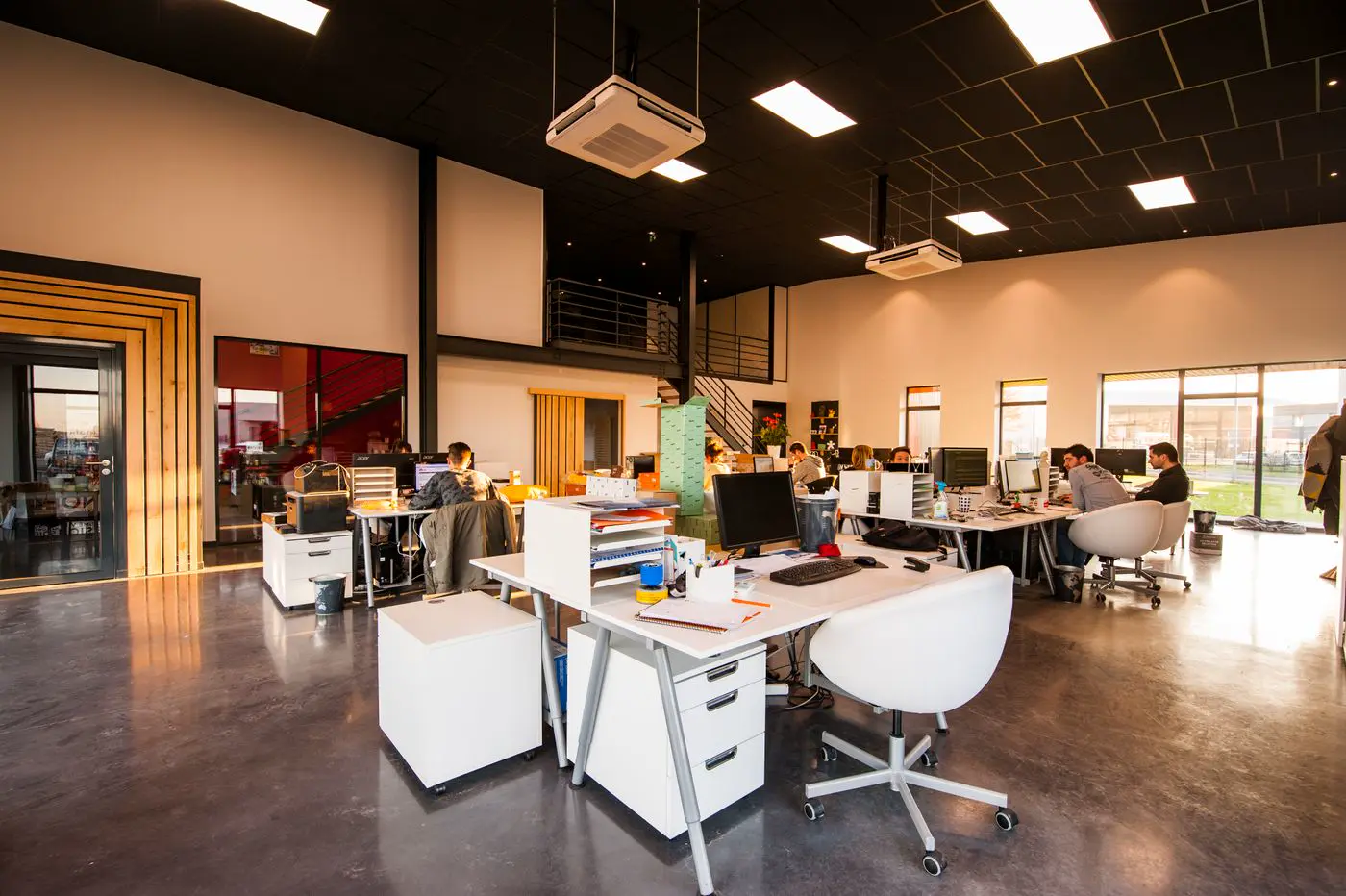Open-plan GEMSOFT office with rows of desks